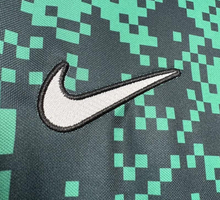 maillotsportingprematchnike.jpg Sporting CP Vorbereitungstrikot 2024-2025 Stoffdetail